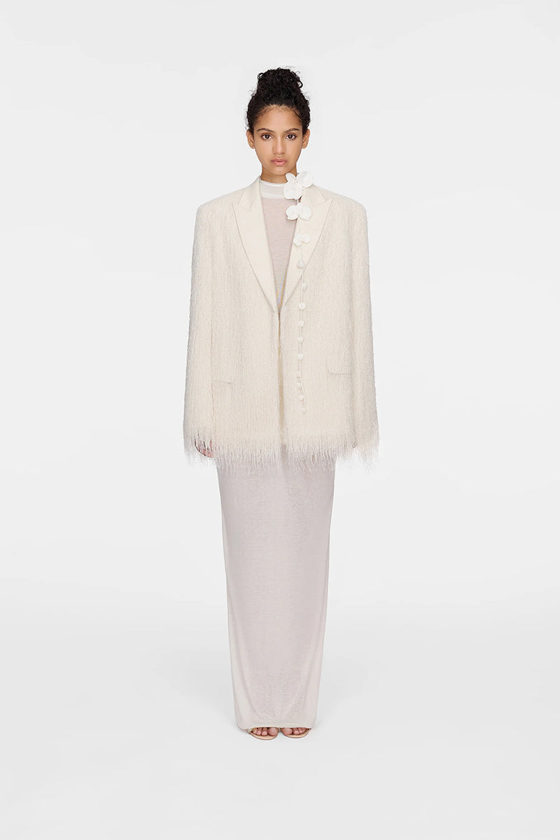 White Montsand Bailey jacket, stylish women's jacket with a sleek white design, shown on a hanger in a retail display.