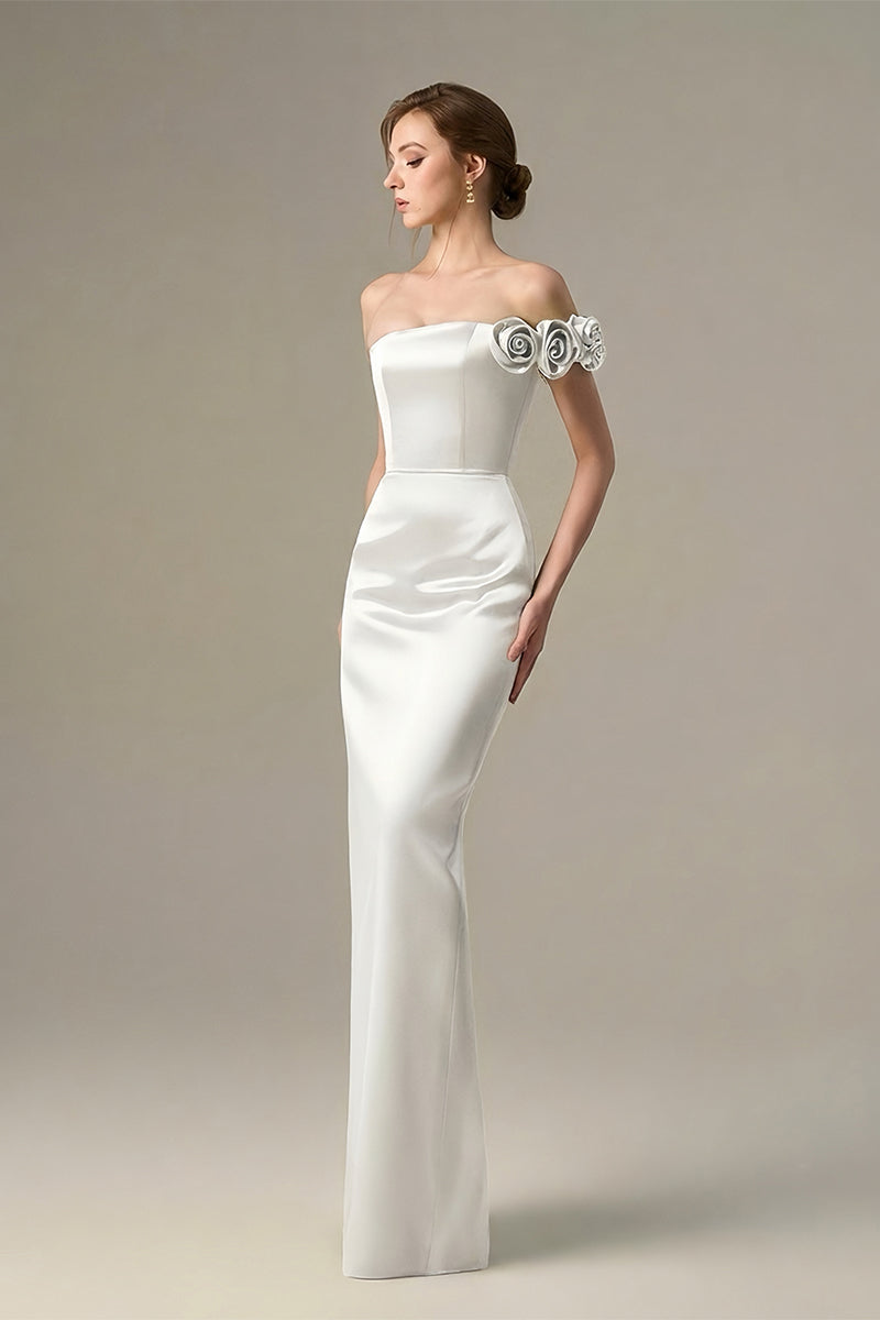 White I.H.F maxi bustier gown with satin floral appliqué, elegant and flowy evening dress with fitted bodice and floral details.