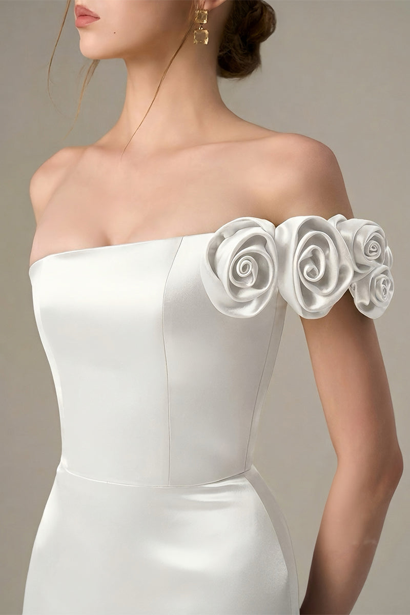 White I.H.F maxi gown with a bustier style and satin floral appliqué, elegant and flowing for special occasions.