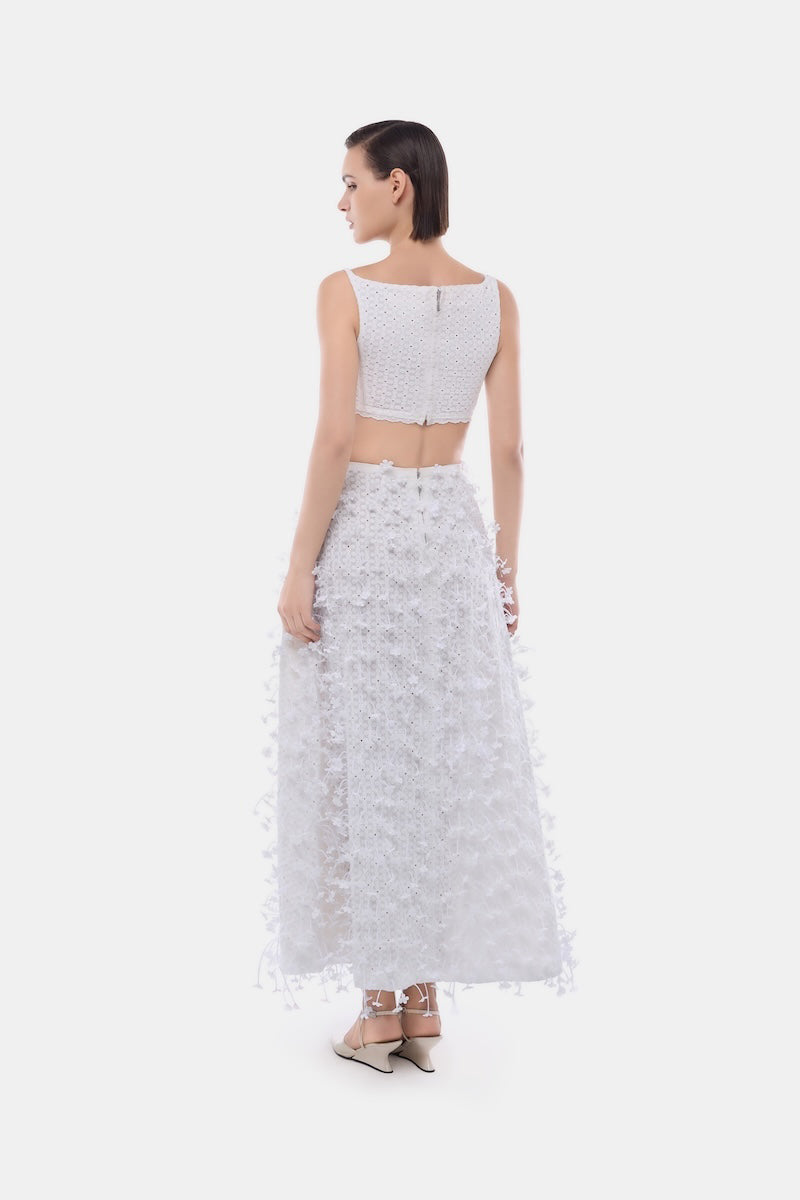 White 3D floral midi skirt by Montsand, featuring a feminine design with intricate floral details and a midi length.