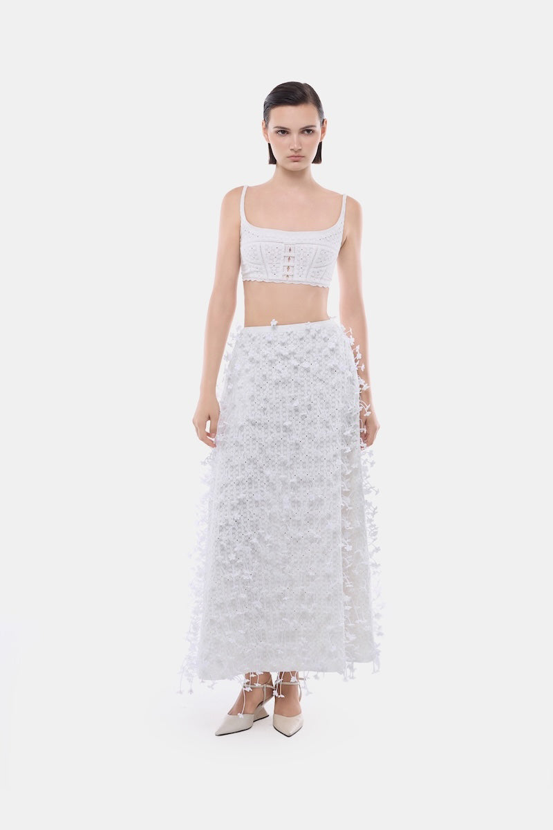 White 3D floral midi skirt by Montsand, featuring a feminine, textured design perfect for stylish, elegant outfits.