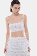 White crop top from Montsand paired with a white 3D floral midi skirt, showcasing a stylish, coordinated outfit.