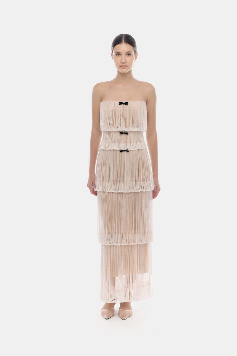 White fringe tube maxi dress by Montsand, featuring a flowing design with fringe details for a stylish, boho-inspired look.