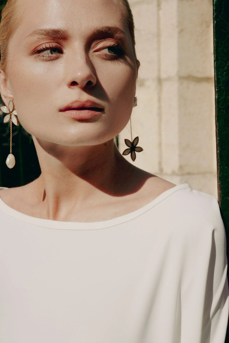 Lavani Jewels white lotus earrings featuring intricate floral design and elegant craftsmanship.