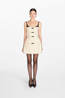 White Montsand Margo midi dress featuring a sleek design and elegant fit, perfect for stylish occasions.