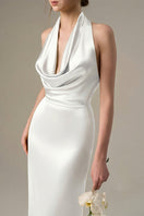White satin silk halter gown with pleated detailing by I.H.F, shown on a model with elegant draping and a sleek silhouette.