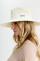 White Seashell London hat by LE SH KA, featuring a stylish white seashell design, perfect for summer accessories.