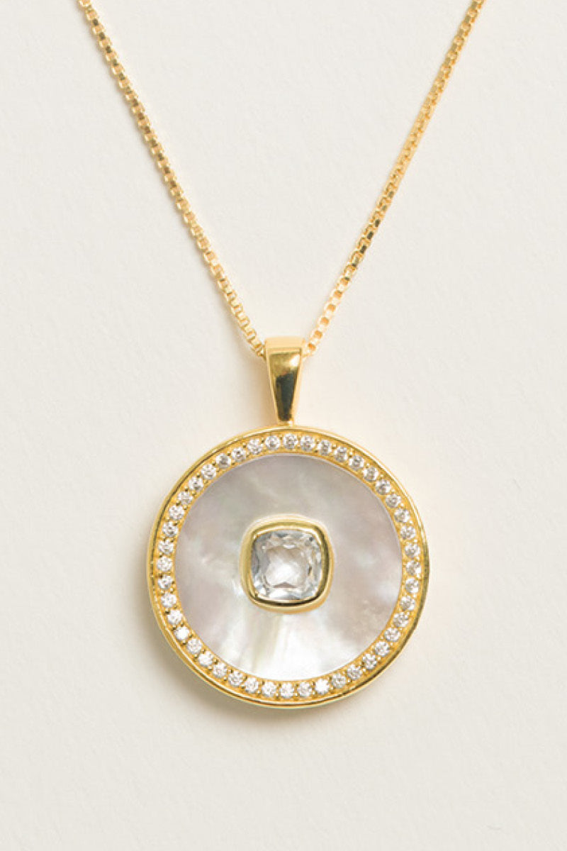 White topaz and mother-of-pearl necklace by Freya Rose featuring vermeil gold setting and April birthstone design.
