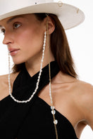 White canotier hat by LE SH KA featuring a classic straw design and wide brim, perfect for sunny summer styling.
