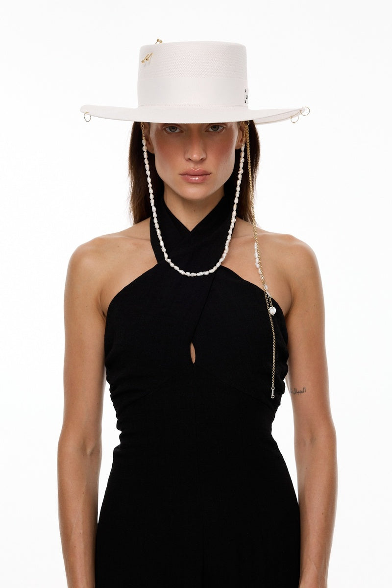 White canotier hat by LE SH KA with a wide brim and ribbon detail, perfect for summer or stylish outdoor wear.
