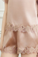 Pink silk short-sleeve pajama set for women by MANITO, featuring a comfortable, elegant design perfect for sleepwear.
