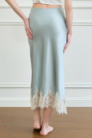 Green Windy Women's silk midi skirt from MANITO featuring a flowing, elegant design perfect for stylish outfits.