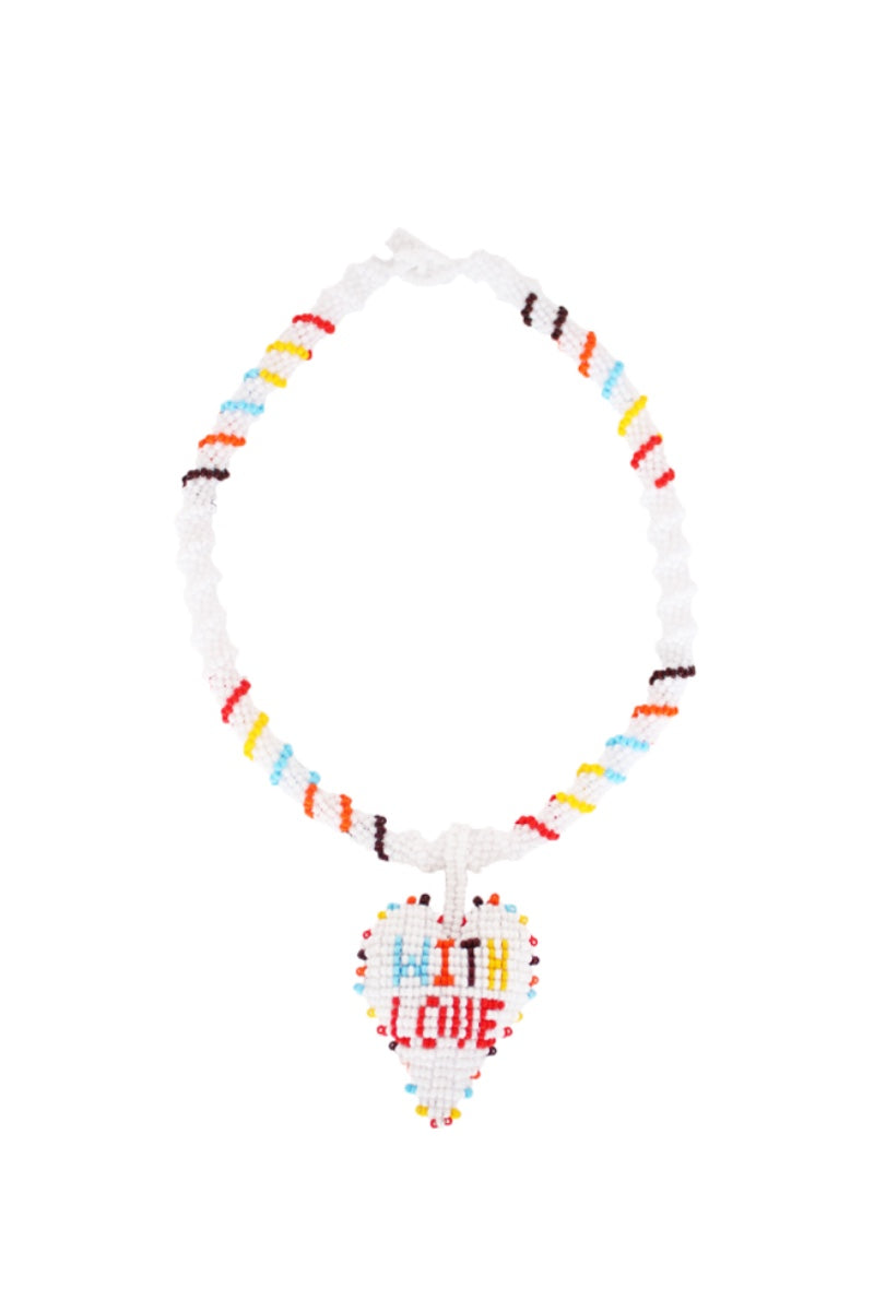 White With Love short necklace by Pájara Pinta featuring a delicate chain and small pendant, styled for casual or elegant outfits.