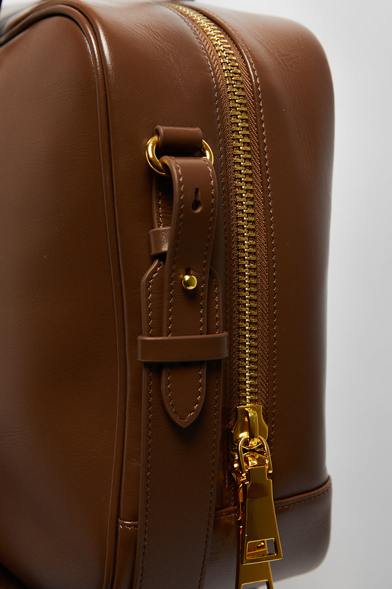 Leather work bag in mocha with top handle design from Folklore The Label, showcasing its spacious interior and stylish craftsmanship.