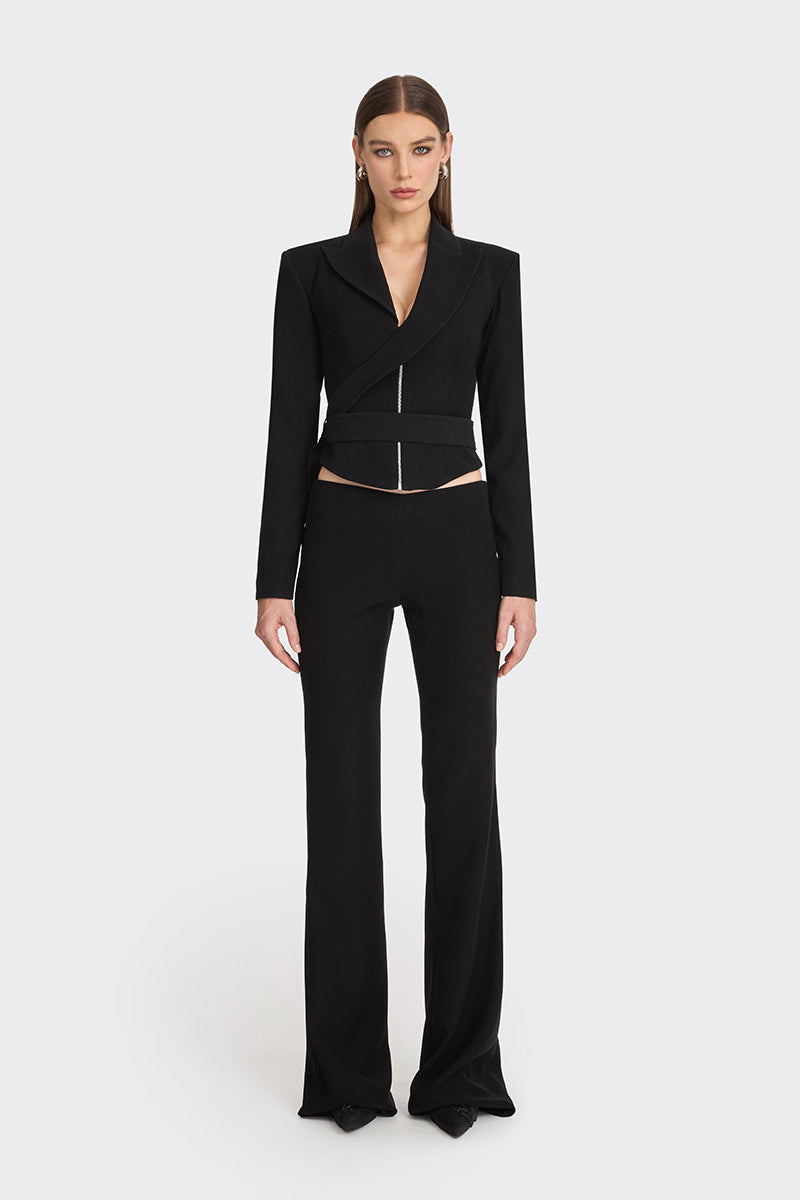 Black wrap blazer from Stolen Stores featuring a tailored design and long sleeves, shown on a model.