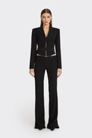Black wrap blazer from Stolen Stores featuring a tailored design and long sleeves, shown on a model.