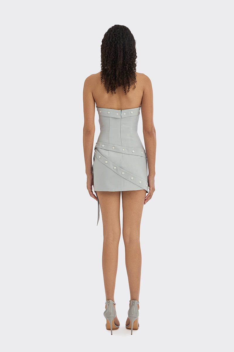 Dusty blue wrap button mini dress by Stolen Stores, shown on a model, featuring a fitted silhouette and elegant design.