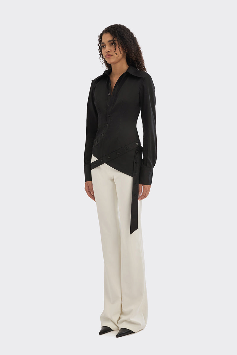 Black wrap button shirt by Stolen Stores, shown on model with long sleeves and a fitted silhouette.
