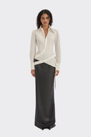 White wrap button shirt by Stolen Stores, featuring a stylish collar and long sleeves, displayed on a mannequin.