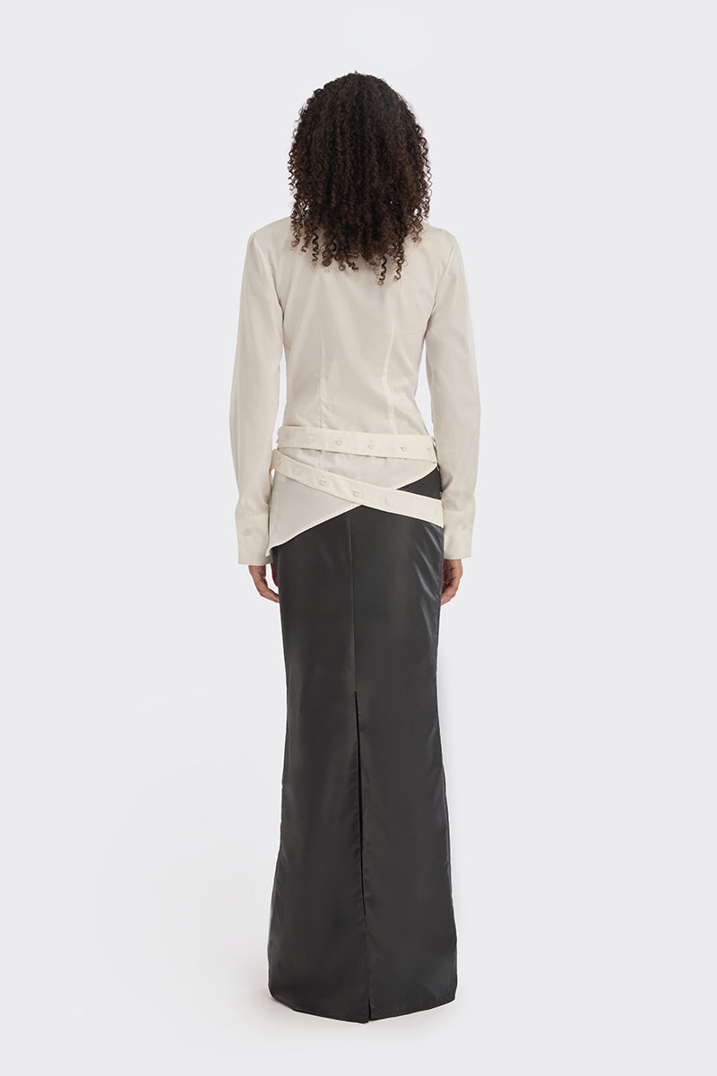 White wrap button shirt from Stolen Stores featuring a stylish collar and long sleeves, displayed on a hanger.