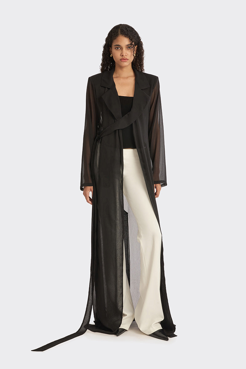 Black sheer wrap outerwear robe by Stolen Stores, lightweight and elegant, shown hanging with its flowing fabric.