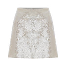Nazlı Ceren cloud cream sequin A-line mini skirt, showcasing its shimmering fabric and stylish fit on a model.
