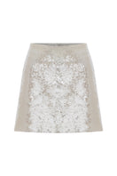 Nazlı Ceren cloud cream sequin A-line mini skirt, showcasing its shimmering fabric and stylish fit on a model.