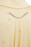 Tagg oversized shirt with crystal embroidery, featuring a relaxed fit and intricate sparkling details on soft fabric.