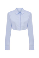 Tagg cropped poplin shirt with shoulder pads, featuring a fitted design and classic collar, shown on a white background.