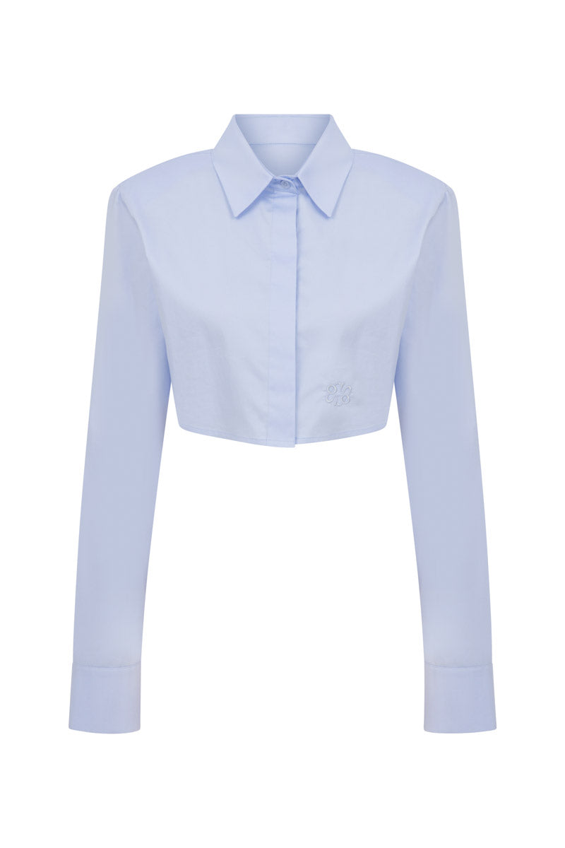 Tagg cropped poplin shirt with shoulder pads, featuring a fitted design and classic collar, shown on a white background.