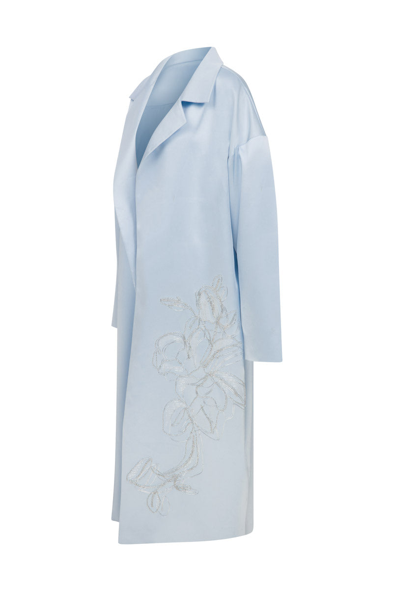 Embroided baby blue satin coat by TAGG, featuring detailed embroidery and a smooth, shiny satin fabric for infants.