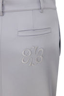 Tagg structured silver satin maxi skirt shown with pleats and a flowing silhouette, perfect for elegant casual wear.