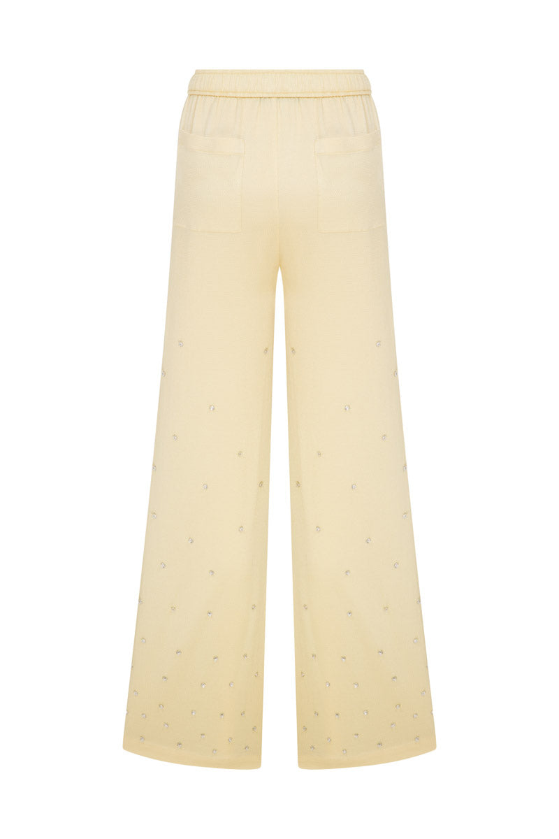 Tagg oversized pants with crystal embroidery, featuring a relaxed fit and decorative embellishments on soft fabric.