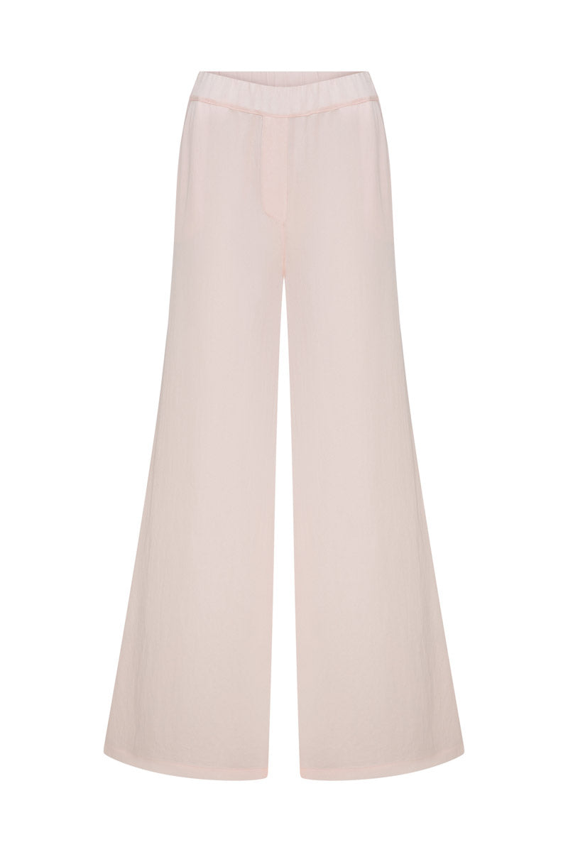 Tagg satin loose pants with elastic waistband, featuring a smooth, shiny fabric and relaxed fit for comfortable style.
