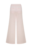 Tagg satin loose pants with elastic waistband, showcasing a smooth, shiny fabric and relaxed fit on a model.