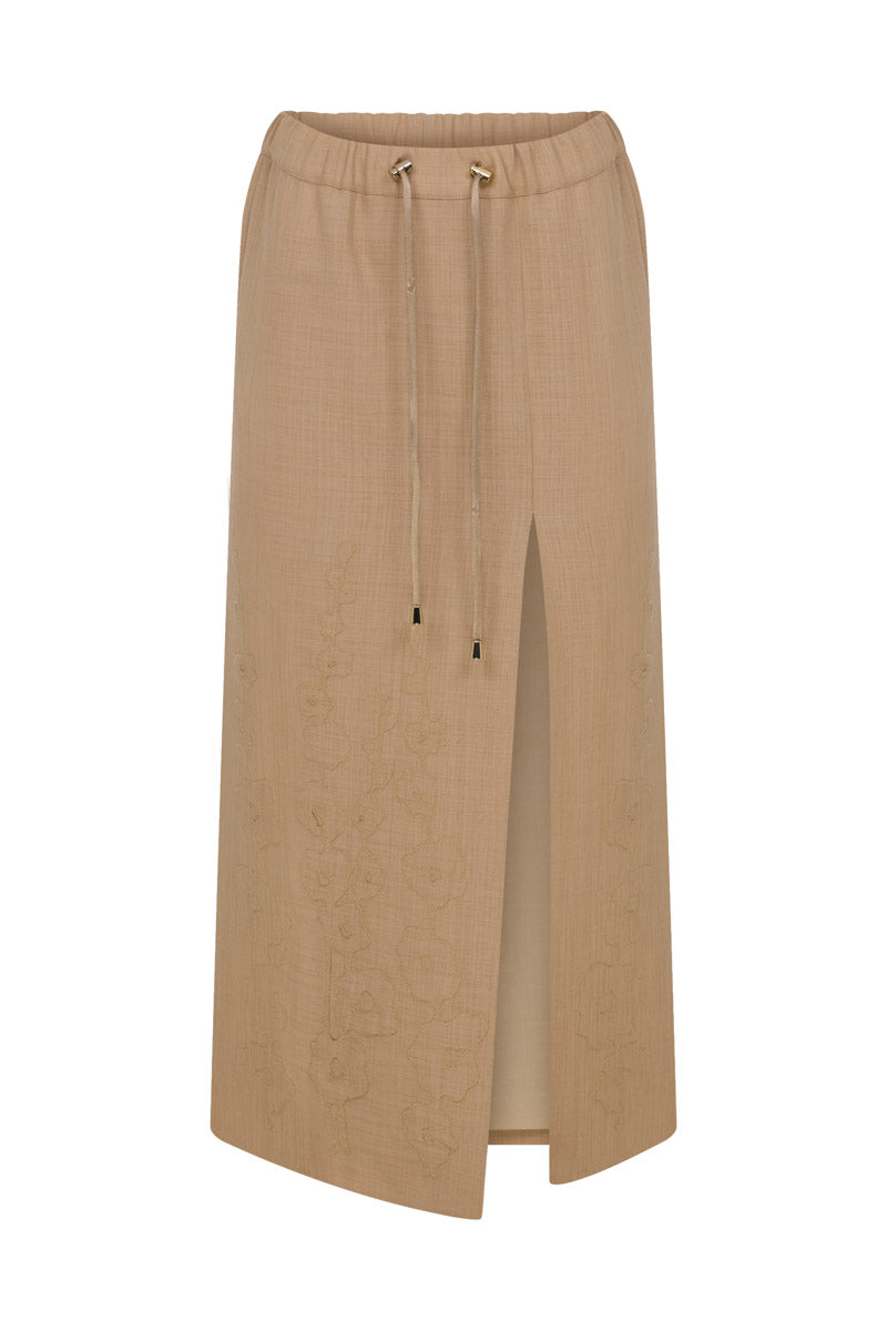 Tagg linen pencil skirt with embroidery, midi length, tailored fit, featuring intricate embroidered details on lightweight fabric.