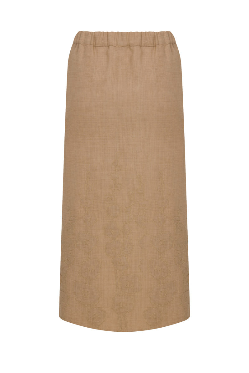 Light beige linen pencil skirt with intricate embroidery, midi length, designed by TAGG, showcased on a plain background.