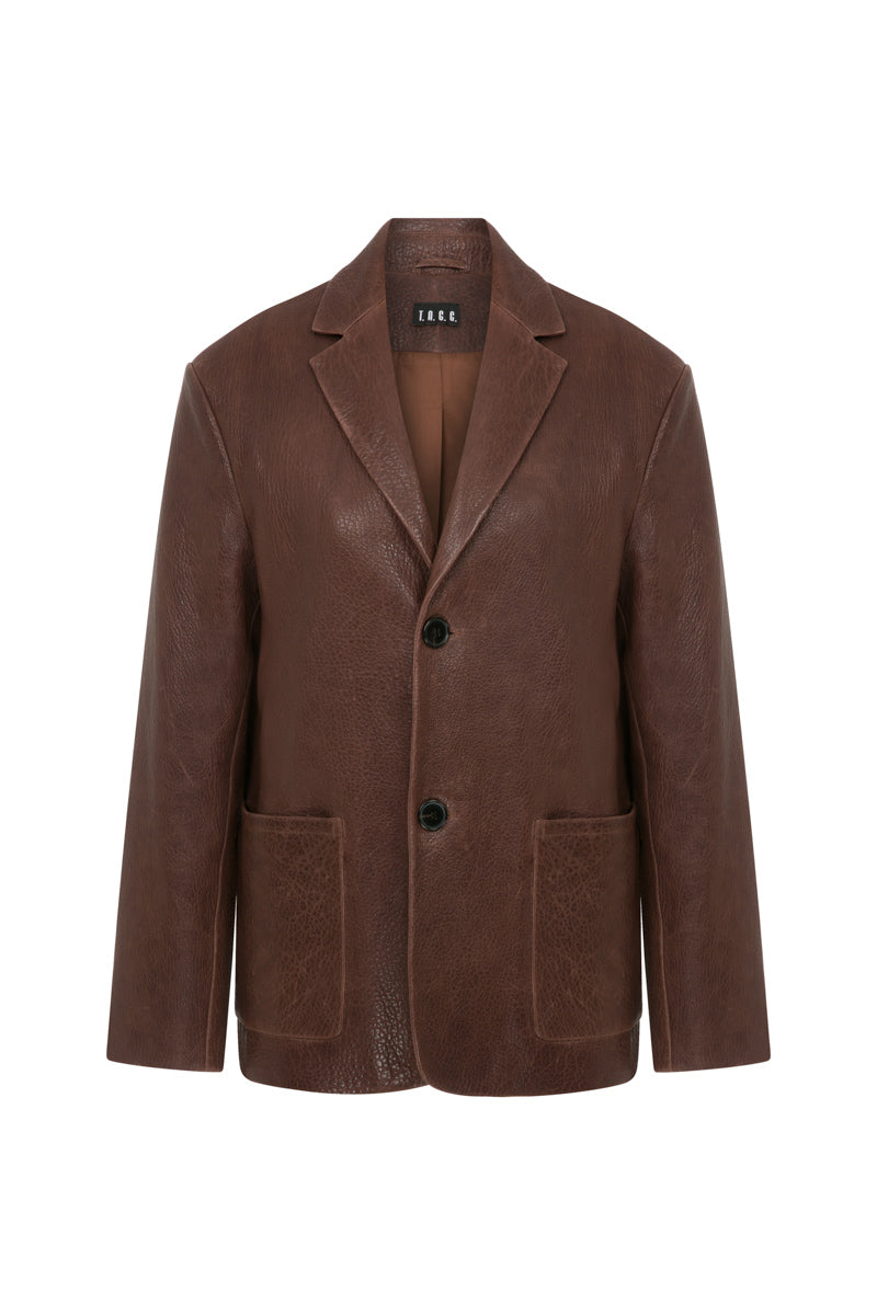 Brown leather mid-oversized jacket by TAGG, featuring a classic design and relaxed fit, shown on a model.