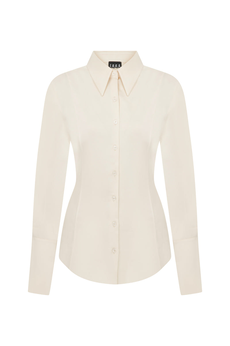 Ecru TAGG shirt with pearl buttons, long sleeves, and classic collar, displayed flat on a white background.