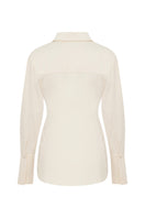 Ecru TAGG shirt with pearl buttons, long-sleeve design, and classic collar, displayed on a hanger against a plain background.