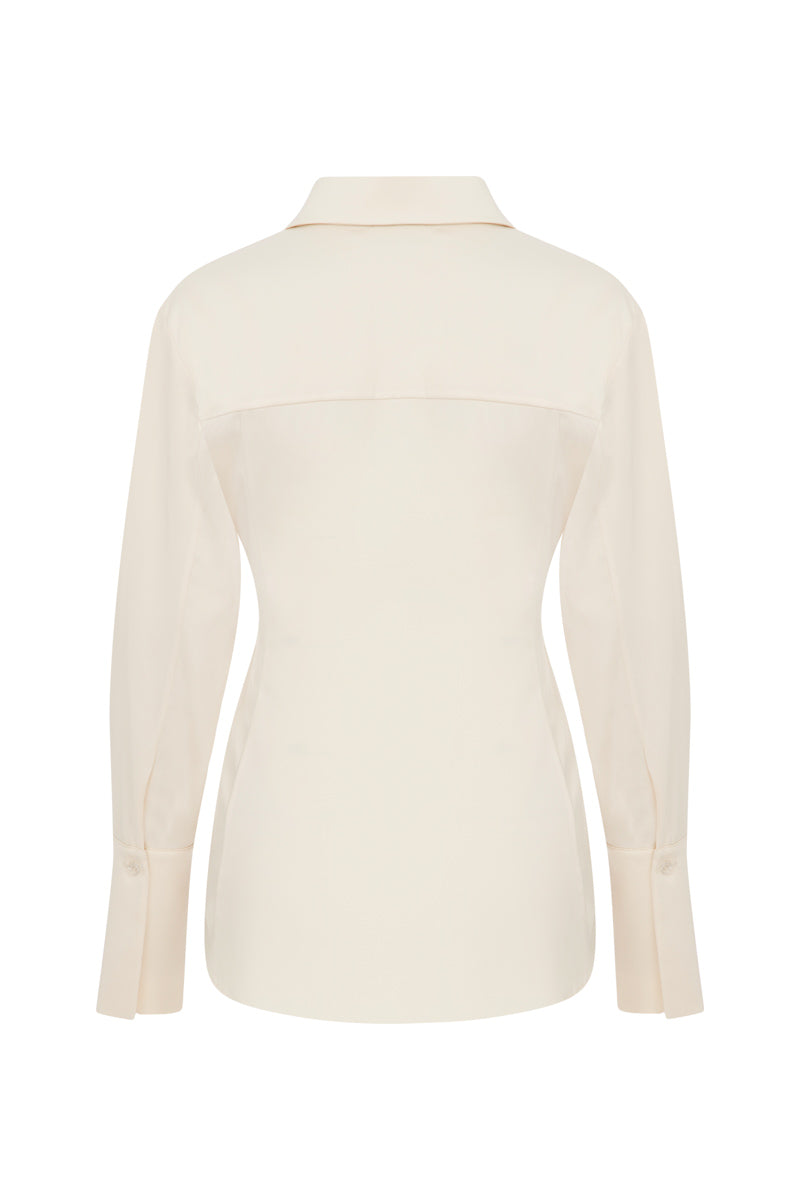 Ecru TAGG shirt with pearl buttons, long-sleeve design, and classic collar, displayed on a hanger against a plain background.
