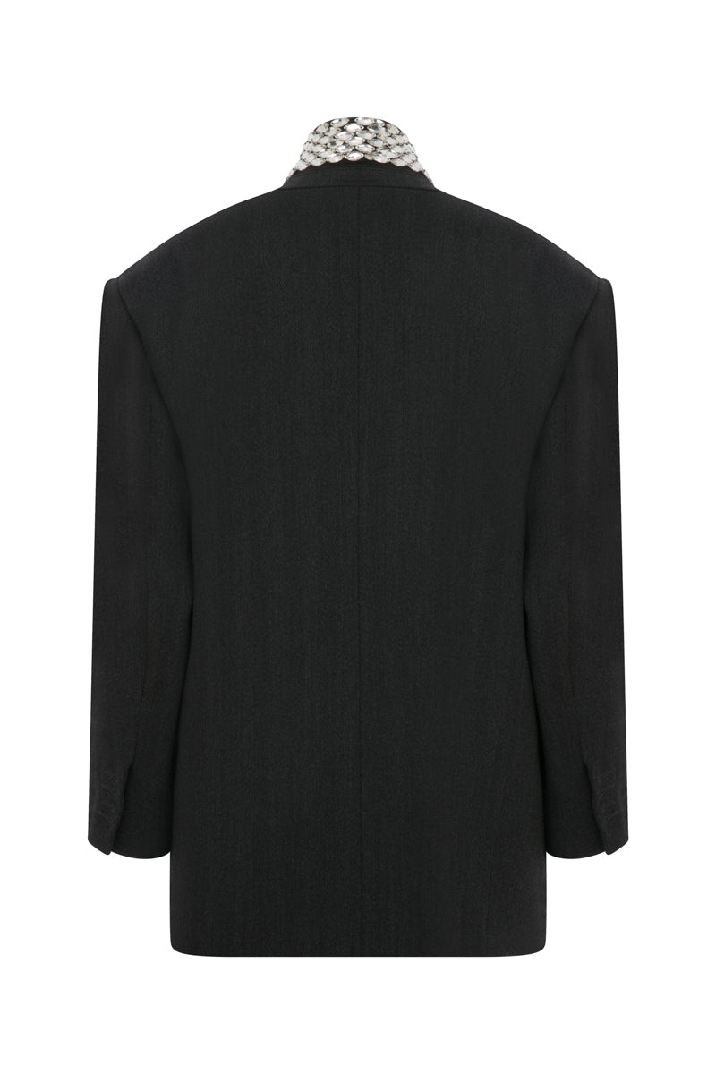 Gray oversized jacket by TAGG with hand-embellished collar detail, shown from the front on a plain background.