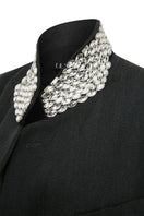 Gray oversized jacket by TAGG featuring hand-embellished collar details and a relaxed fit, displayed on a hanger.