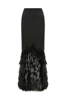 Black embellished mermaid maxi skirt by TAGG, featuring fitted waist, flowing fabric, and decorative embellishments for elegant style.