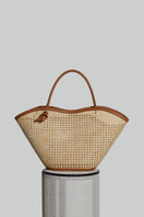 Camel-colored XL Cella chair-shaped shoulder bag by Folklore The Label, showcasing its unique design and spacious interior.
