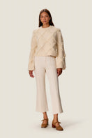 Rebecca Taylor Thea fringe sweater in alabaster, featuring a cozy knit with fringe details, styled on a model.