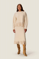 Rebecca Taylor Emelia Fringe Sweater Skirt in alabaster, midi length with fringe detailing, styled for a chic, cozy look.