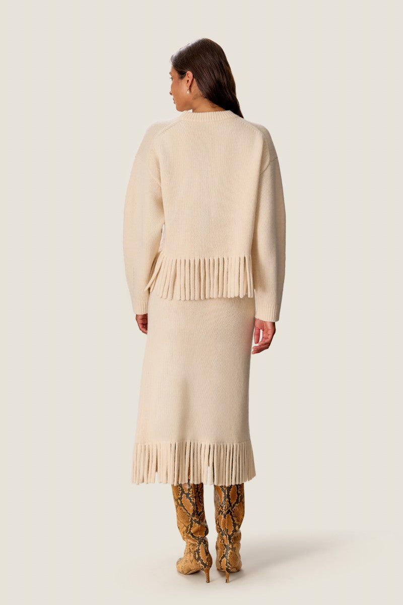 Rebecca Taylor Emelia fringe sweater skirt in alabaster, midi length with fringe details, displayed on a neutral background.