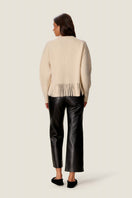 Rebecca Taylor Emelia fringe sweater in alabaster, featuring a cozy knit with fringe details, displayed on a neutral background.