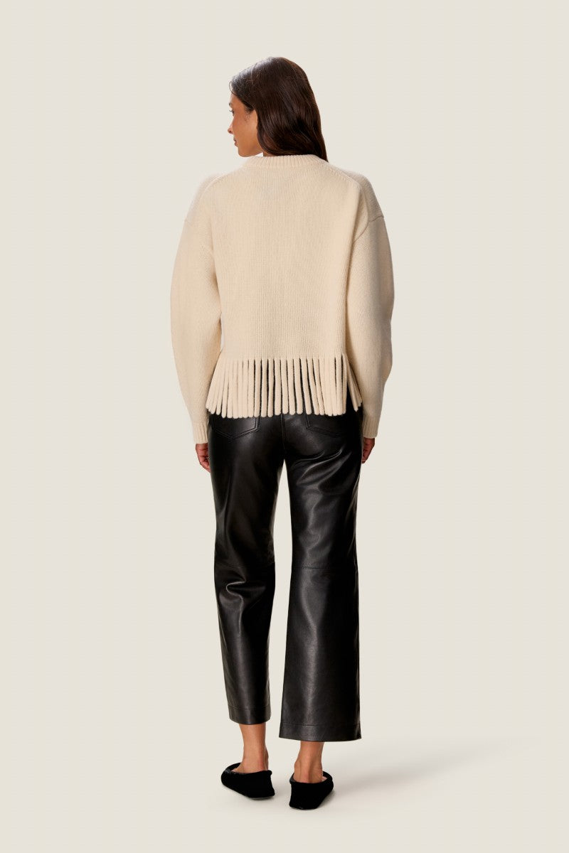 Rebecca Taylor Emelia fringe sweater in alabaster, featuring a cozy knit with fringe details, displayed on a neutral background.
